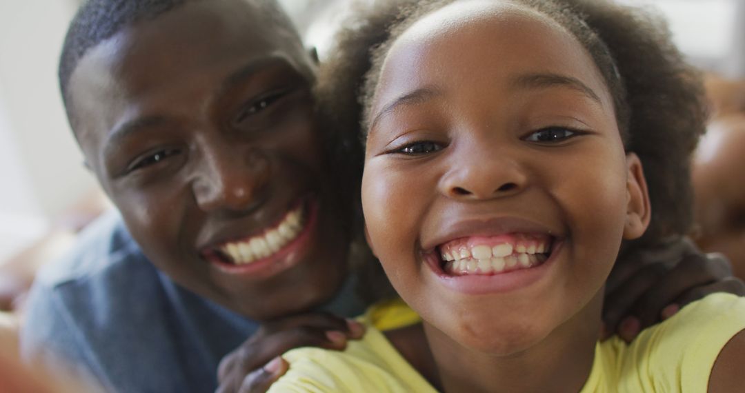 Smiling Father and Daughter Taking Selfie Together - Free Images, Stock Photos and Pictures on Pikwizard.com