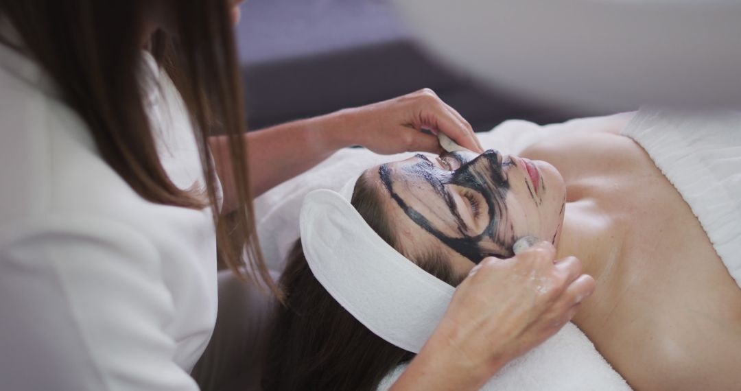 Woman Relaxing with Beauty Face Mask during Spa Treatment - Free Images, Stock Photos and Pictures on Pikwizard.com