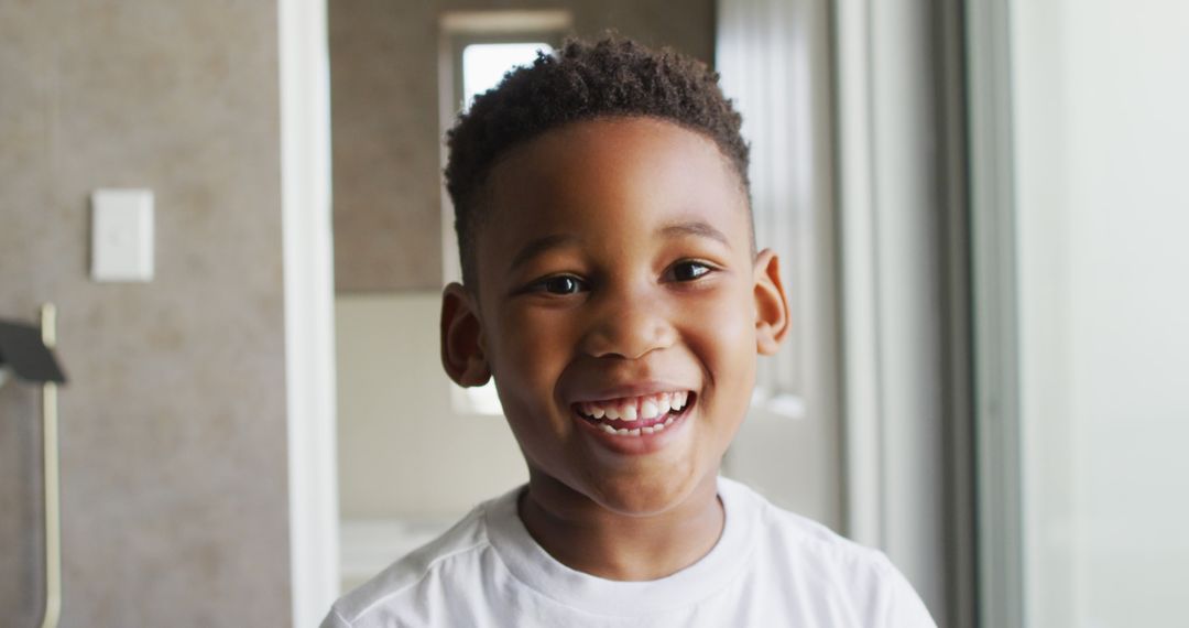 Image of african american boy smiling at camera - Free Images, Stock Photos and Pictures on Pikwizard.com