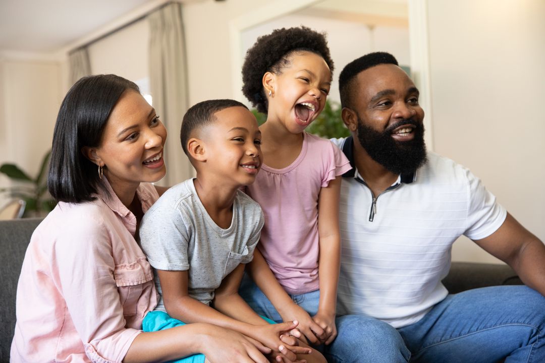 Happy Family Enjoying Quality Time Together on Sofa