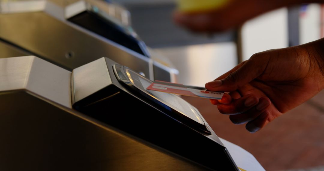 Person Using Access Card at Transportation Turnstile