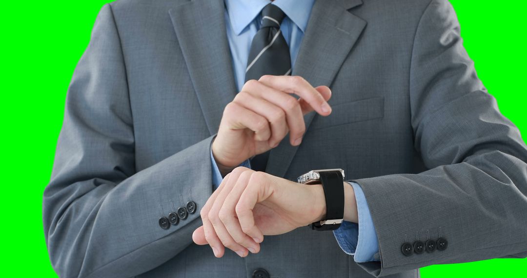 Businessman Checking Time on His Wristwatch in Formal Suit - Free Images, Stock Photos and Pictures on Pikwizard.com