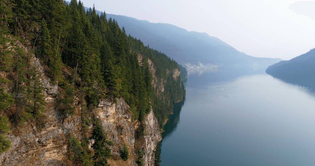 Transparent Tranquility Over Misty Mountain River Scenery