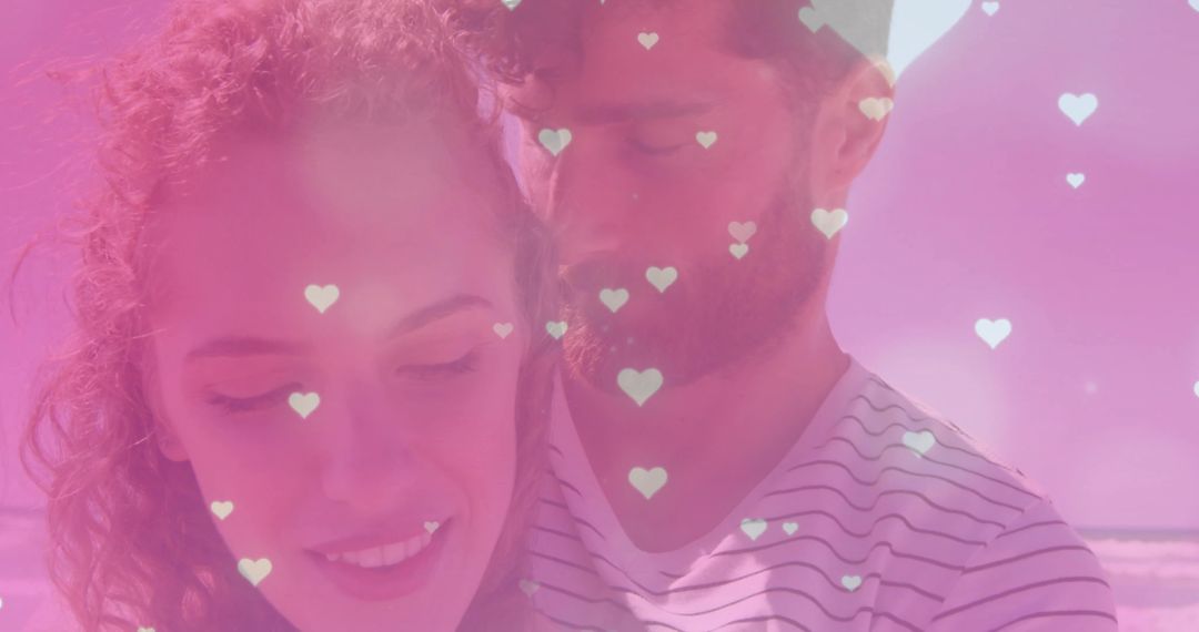 Romantic Couple Embracing on Beach with Heart Graphics