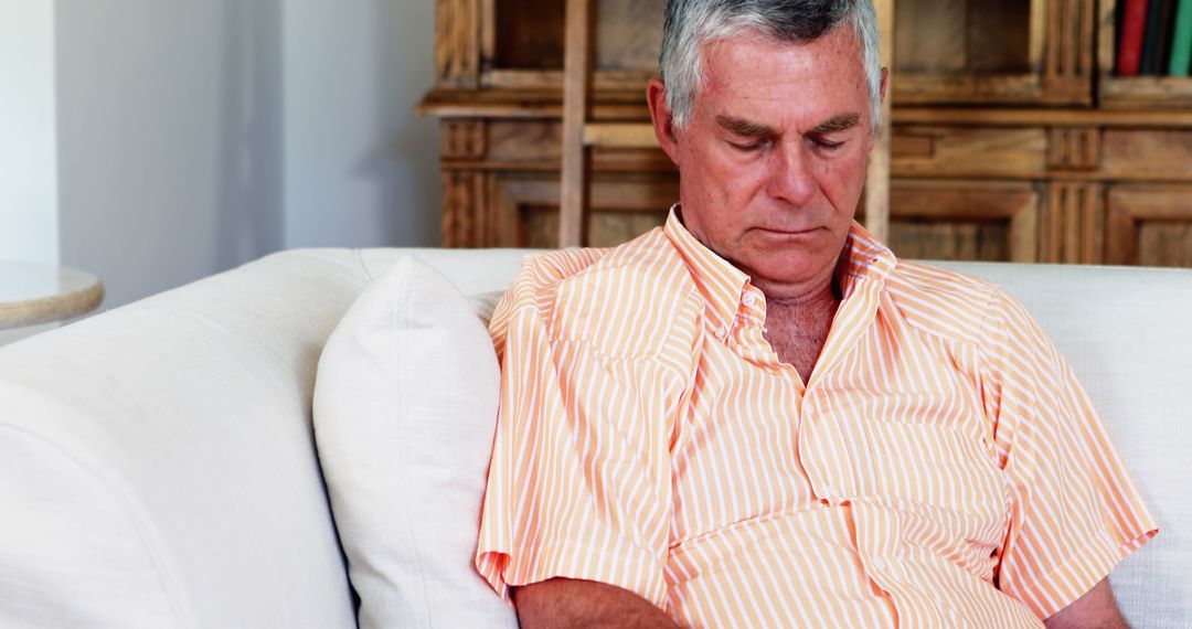 Elderly Man Napping on Sofa at Home - Free Images, Stock Photos and Pictures on Pikwizard.com