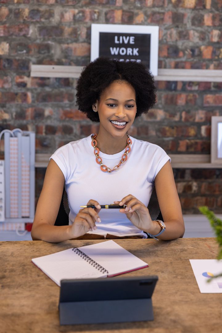 Professional African American Woman Working in Office with Tablet