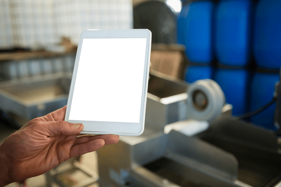 Worker Hand Holding Transparent Tablet in Industrial Factory