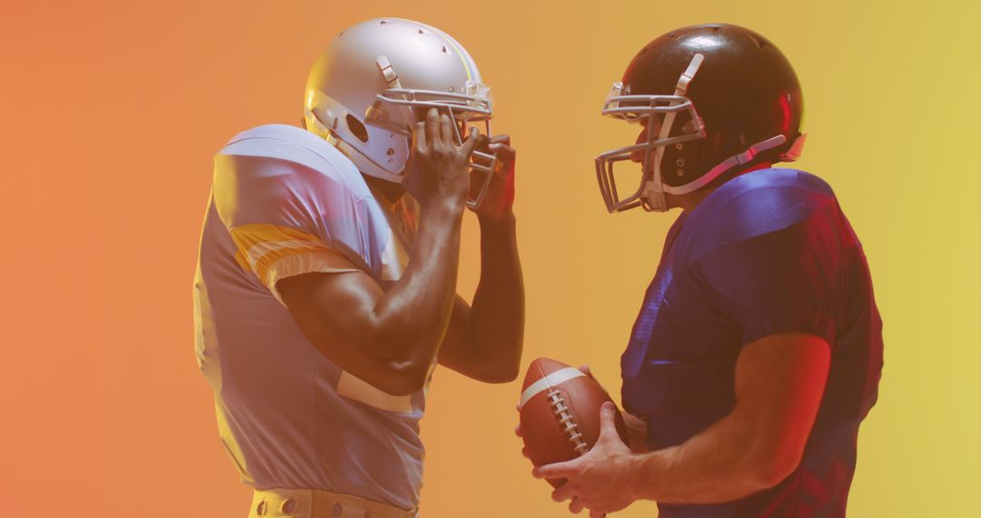 Two American football players in a standoff on vibrant gradient background - Free Images, Stock Photos and Pictures on Pikwizard.com