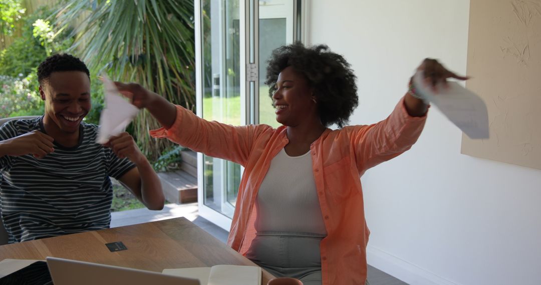 Happy Couple Working from Home with Laptops and Coffee