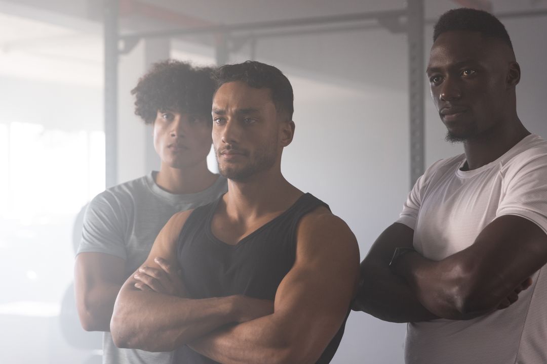 Determined Workout Partners in Gym Display Strength and Teamwork