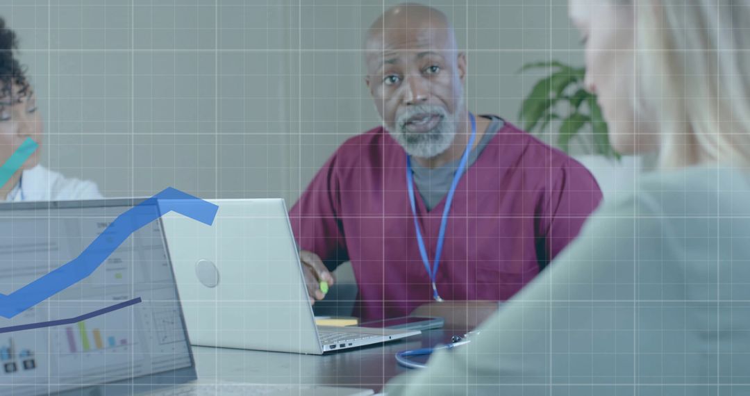 Diverse Medical Team Analyzing Financial Data in Office