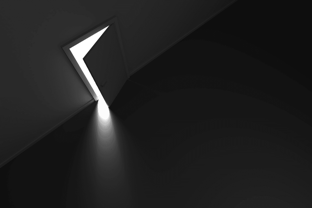 Transparent Light Shining Through Partially Open Door in Dark Room