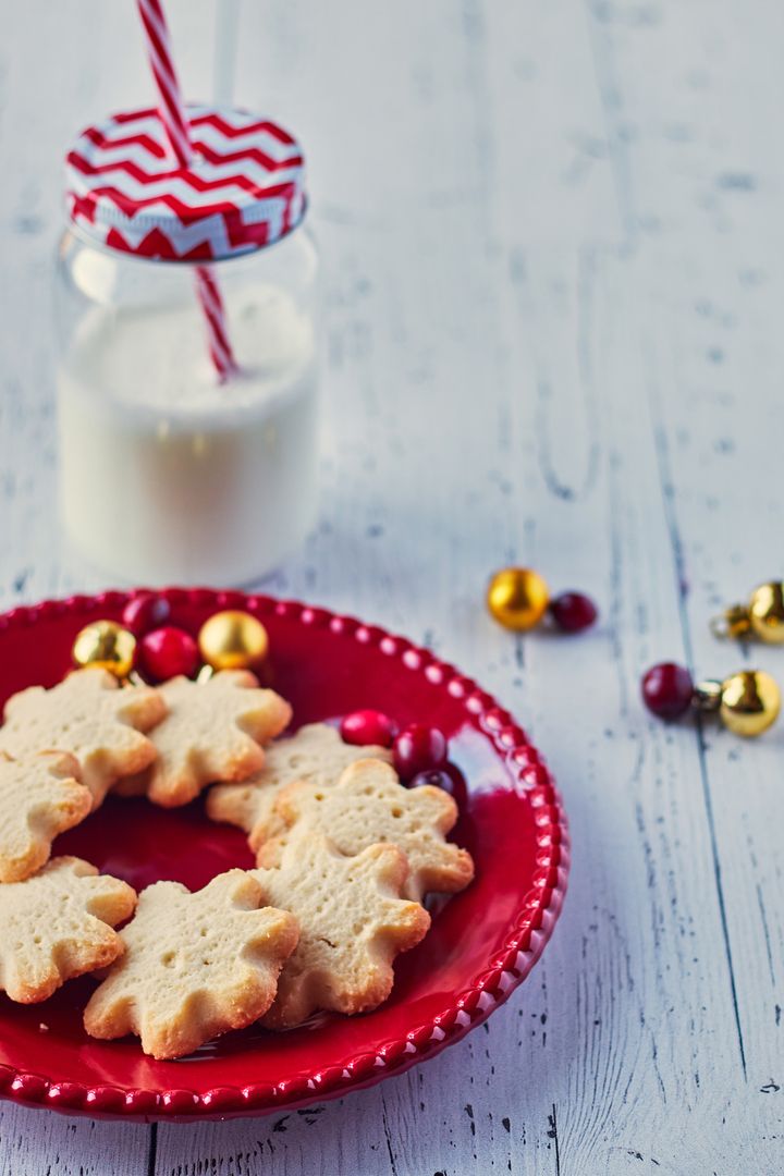 Festive Christmas Cookies with Milk Jar on White Table