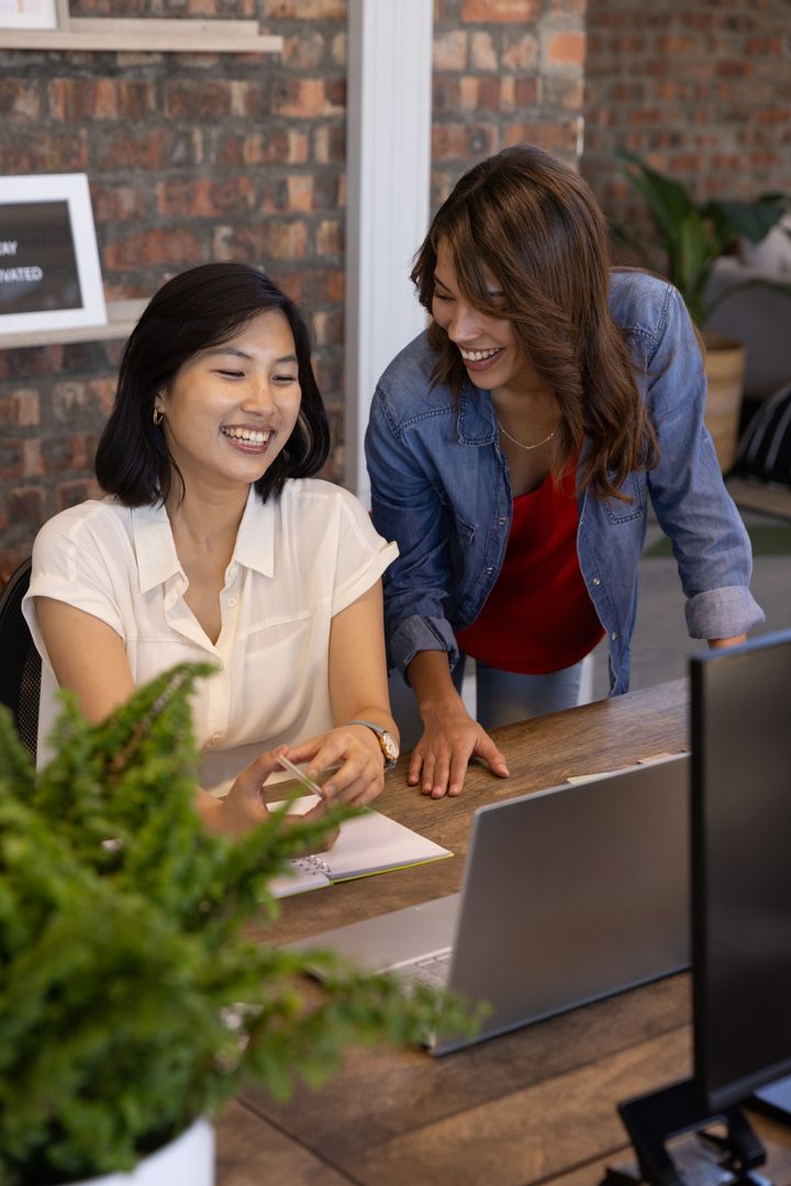 Diverse Coworkers Collaborating at Creative Workspace