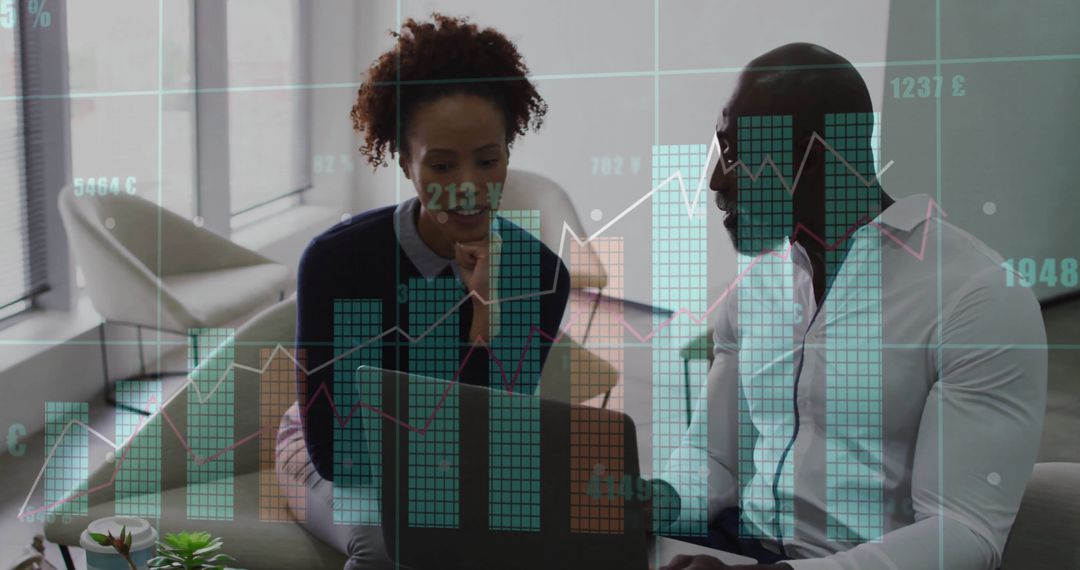 Colleagues Analyzing Data with Charts Overlays in Modern Office