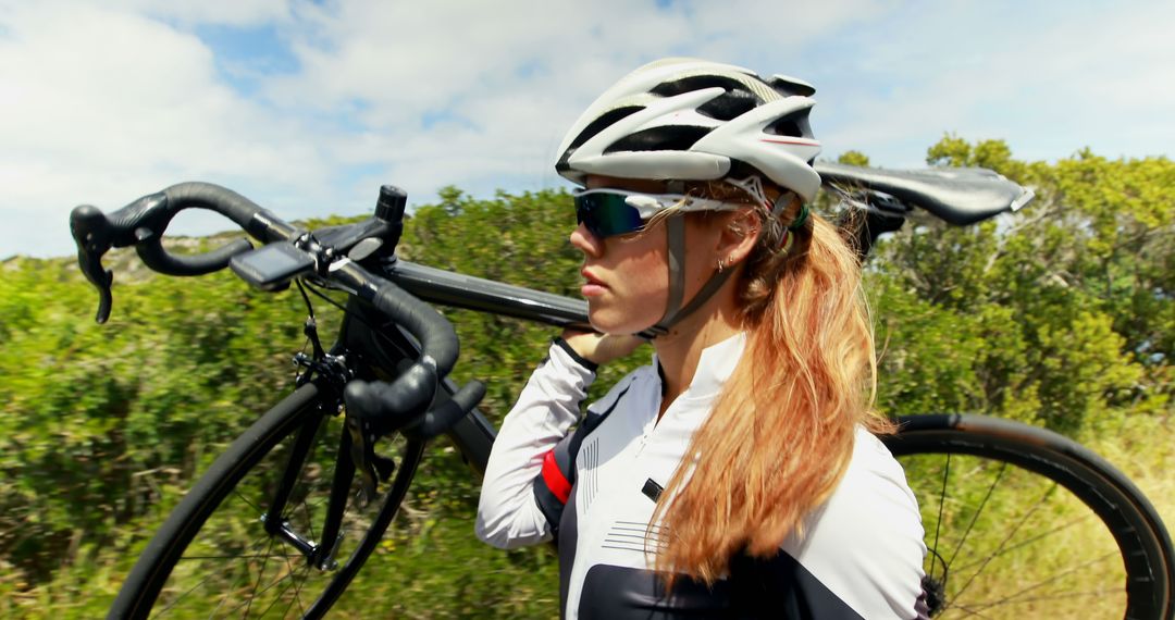 Determined Female Cyclist Carrying Road Bike Outdoors - Free Images, Stock Photos and Pictures on Pikwizard.com