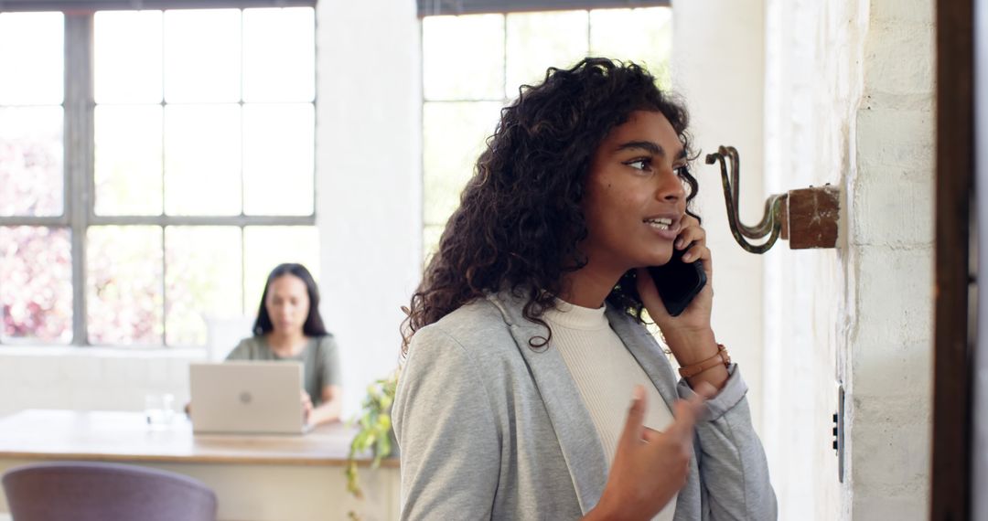 Modern Coworking Space with Professionals Engaged in Tasks