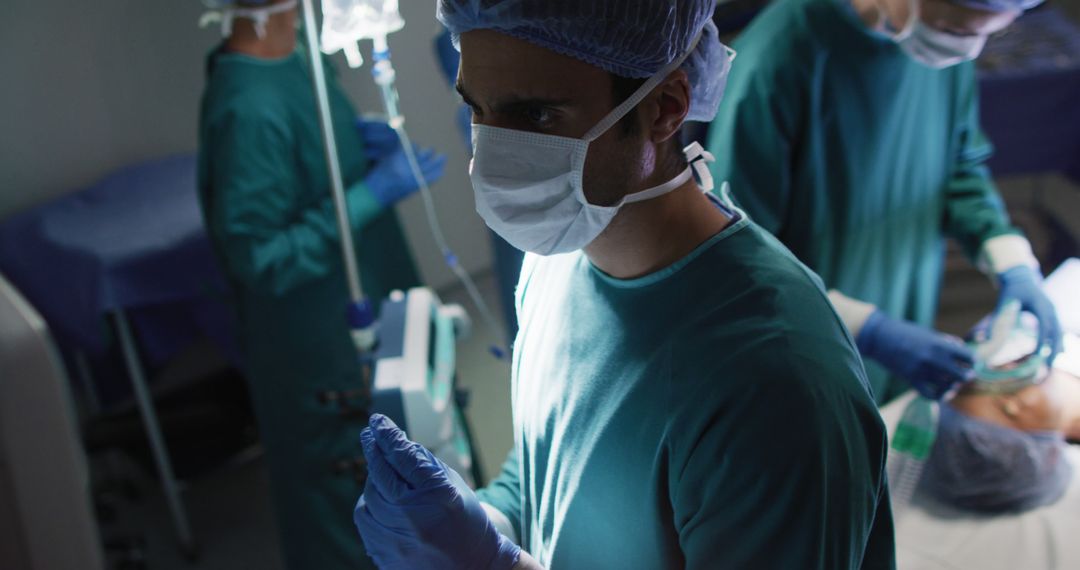 Focused Surgeon In Operating Room Preparing For Procedure - Free Images, Stock Photos and Pictures on Pikwizard.com