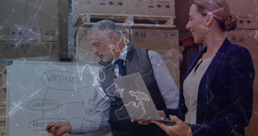 Team Strategizing Logistics with Whiteboard and Laptop in Modern Warehouse