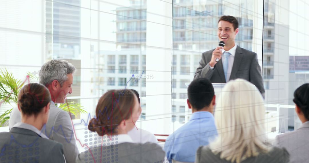 Businessman Giving Presentation to Colleagues in Modern Office - Free Images, Stock Photos and Pictures on Pikwizard.com