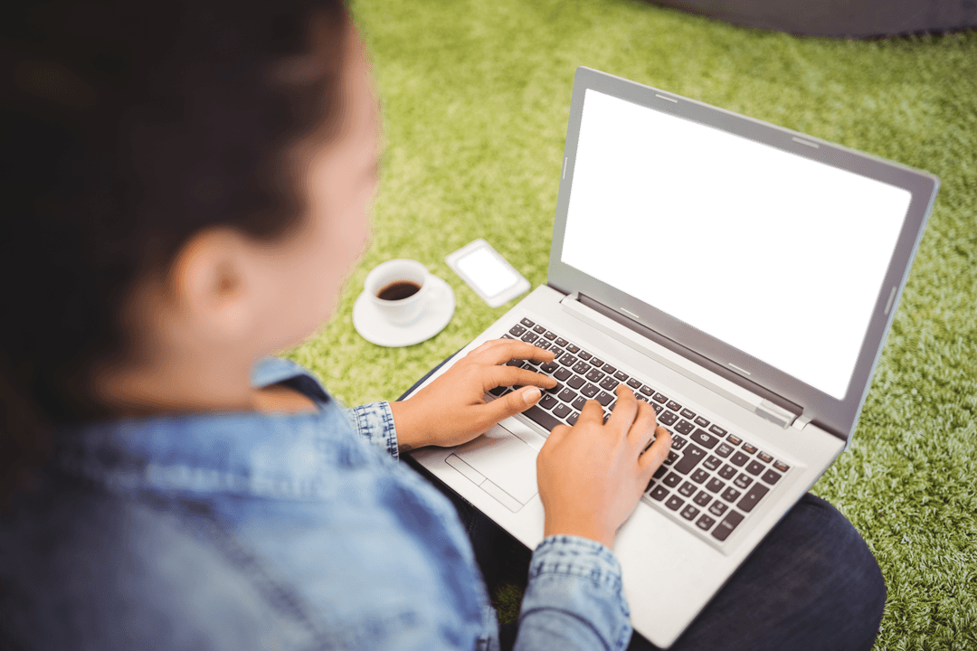 High Angle of Woman Typing on Transparent Laptop in Park Outdoors