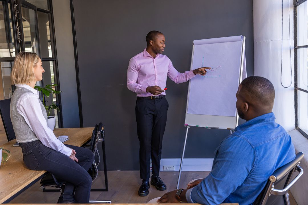 Professional Team Discussing Data Trends in Modern Office