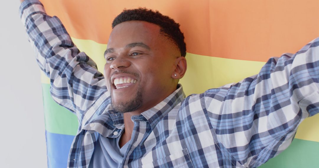 Celebrating Pride with Joyful Expression and Rainbow Flag