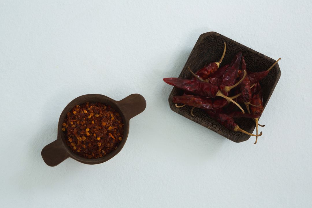 Dried Red Chili Peppers and Crushed Red Pepper in Bowls - Free Images, Stock Photos and Pictures on Pikwizard.com