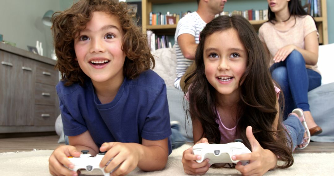 Children Playing Video Games While Parents Talking on Sofa - Free Images, Stock Photos and Pictures on Pikwizard.com