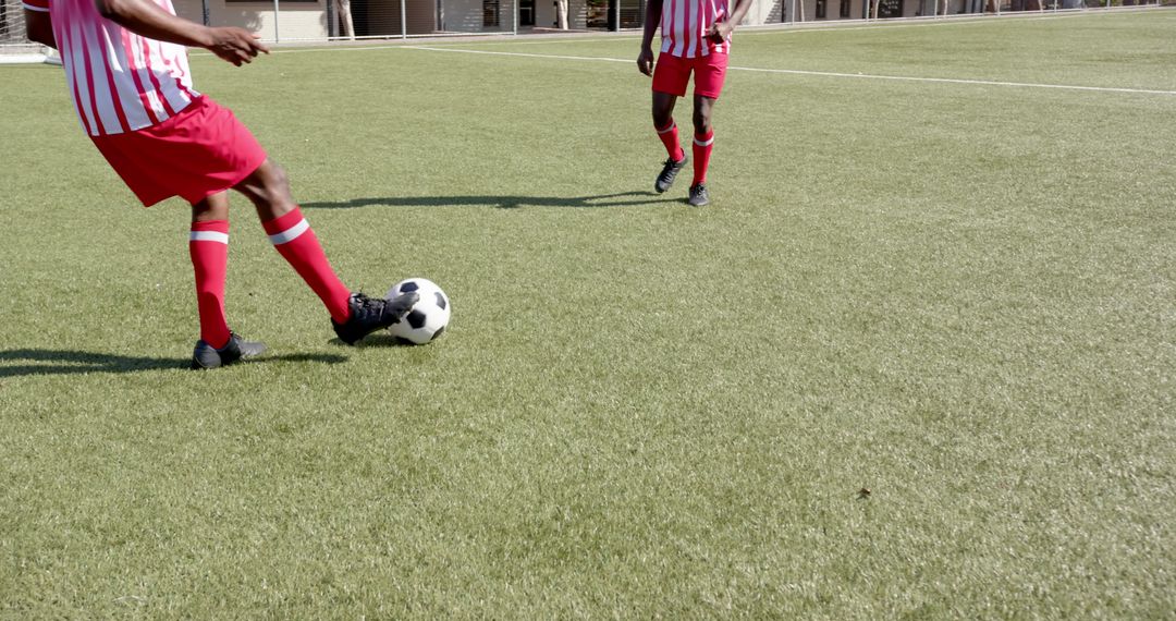 Soccer Players in Action on Artificial Turf Field