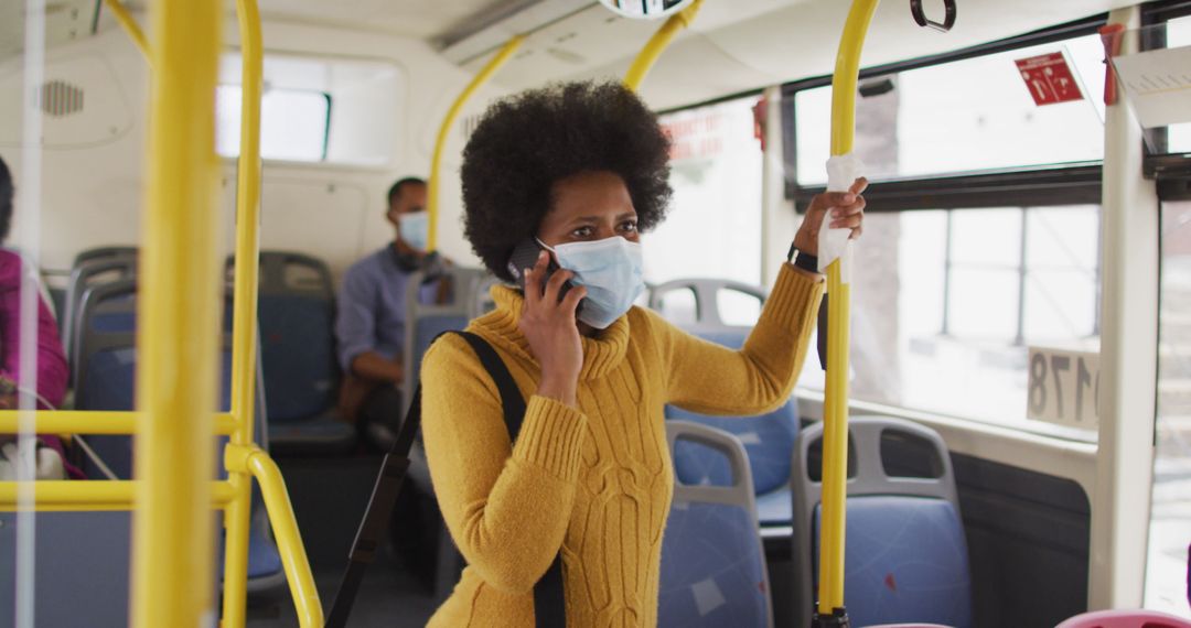 Businesswoman with Mask Engaged in Phone Call on City Bus