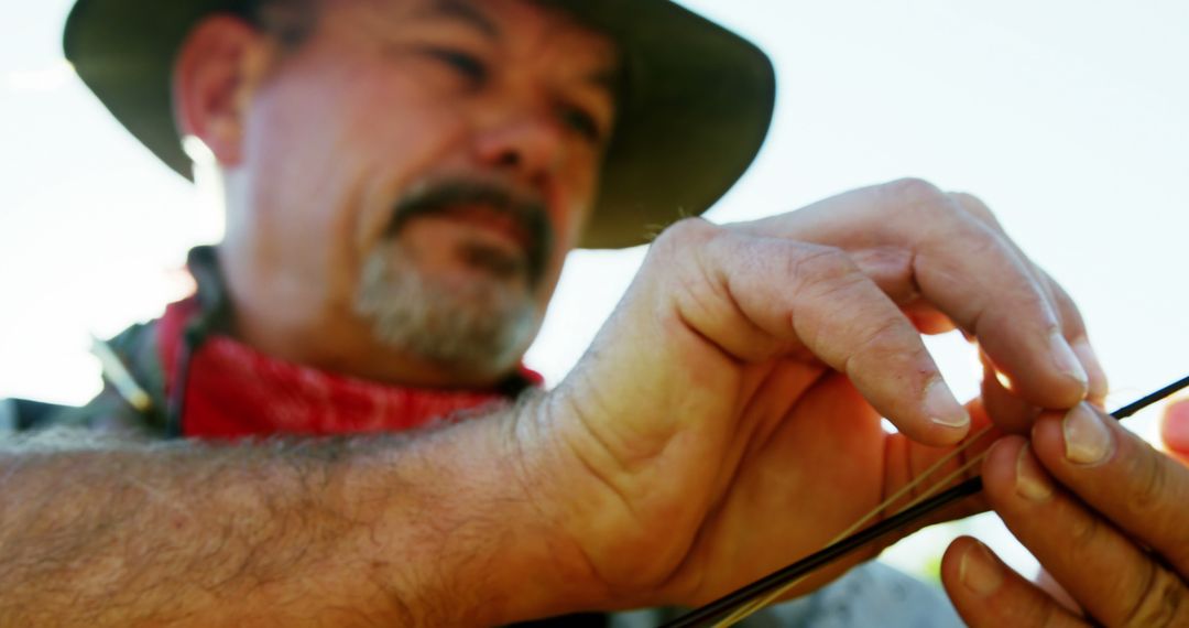 Close-Up of Man Stringing a Fishing Line - Free Images, Stock Photos and Pictures on Pikwizard.com