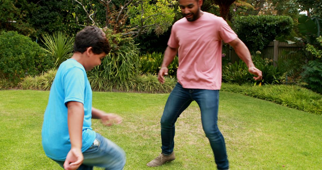 Father and Son Enjoying Backyard Dancing Time Outdoors - Free Images, Stock Photos and Pictures on Pikwizard.com