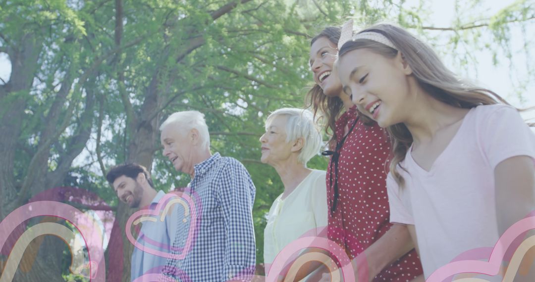 Joyful Multigenerational Family Strolling in Park
