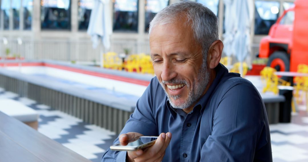 Smiling Mature Man Using Smartphone Voice Assistant Outdoors - Free Images, Stock Photos and Pictures on Pikwizard.com