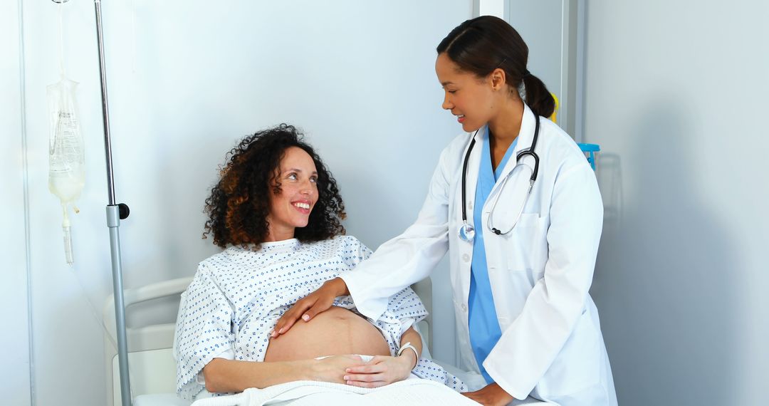 Pregnant Woman Receiving Medical Care from Nurse - Free Images, Stock Photos and Pictures on Pikwizard.com