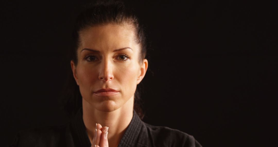 Focused Martial Artist Meditating in Studio - Free Images, Stock Photos and Pictures on Pikwizard.com