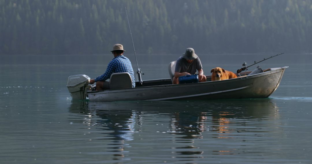 Two Men Fishing in Silent Lake with Their Dog - Free Images, Stock Photos and Pictures on Pikwizard.com