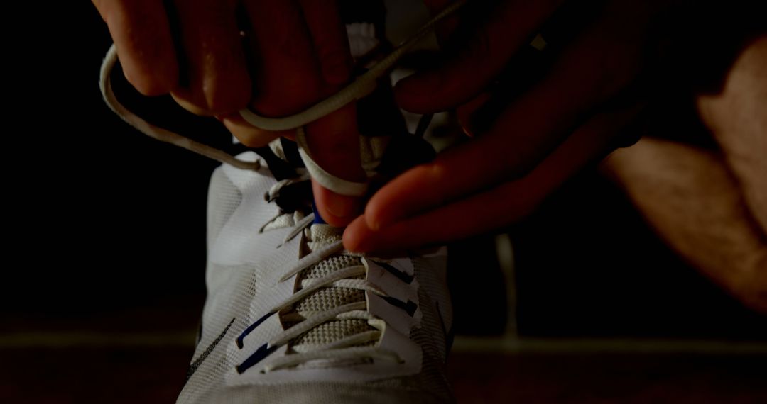 Close-up of Hands Tying Shoe Laces on Athletic Sneakers - Free Images, Stock Photos and Pictures on Pikwizard.com