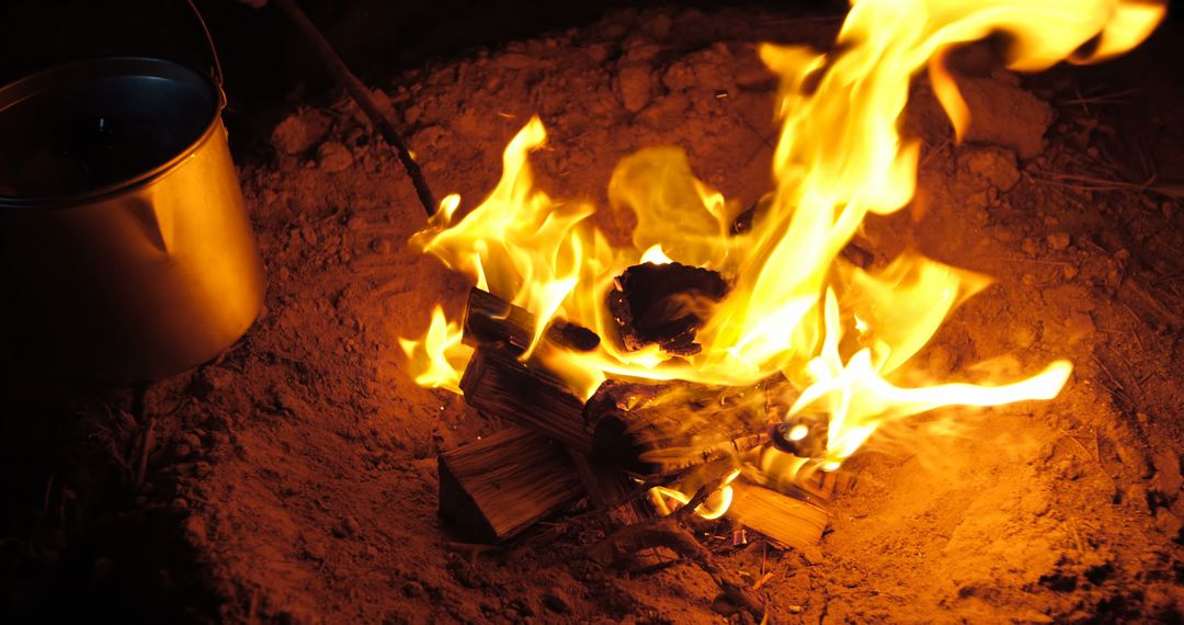 Campfire Burning with Metal Pot in Wilderness - Free Images, Stock Photos and Pictures on Pikwizard.com