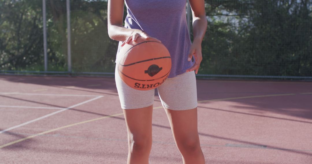 Female Basketball Player Dribbling on Outdoor Court - Free Images, Stock Photos and Pictures on Pikwizard.com