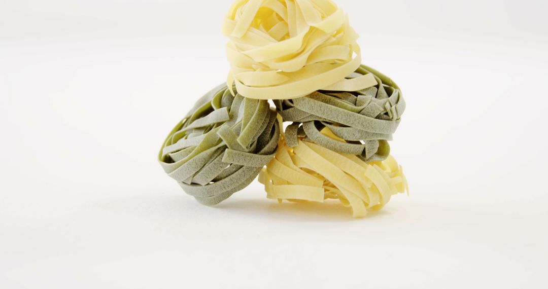 Close-Up of Italian Pasta Nest Varieties on White Background - Free Images, Stock Photos and Pictures on Pikwizard.com