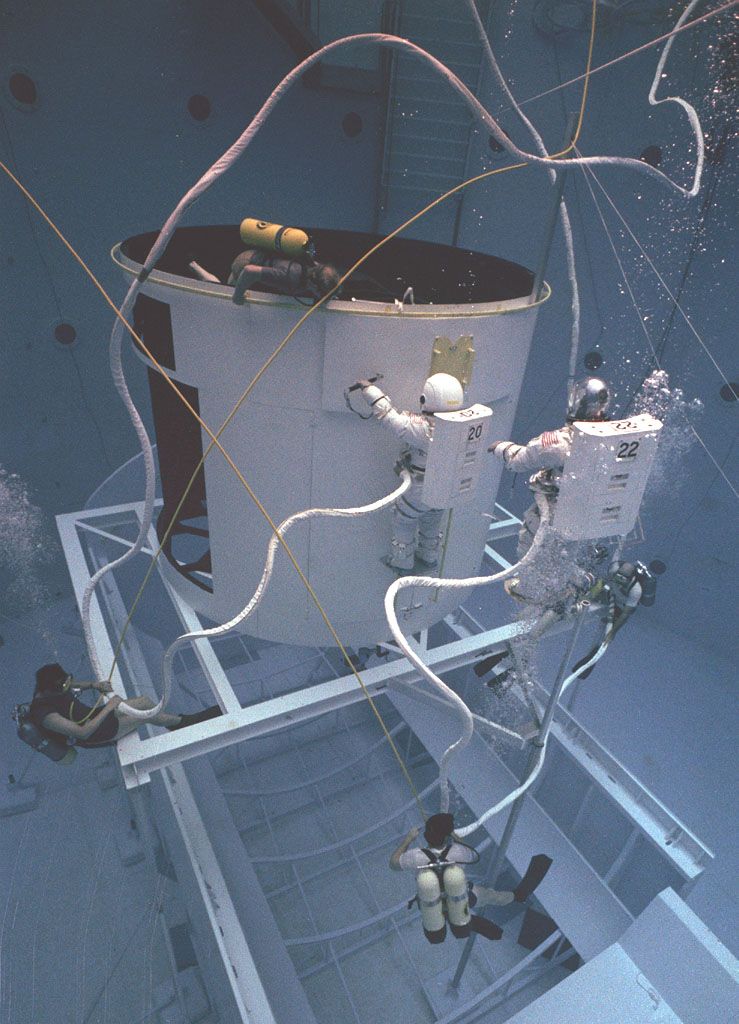 Astronauts Training for Hubble Space Telescope Maintenance in Neutral Buoyancy Simulator - Free Images, Stock Photos and Pictures on Pikwizard.com
