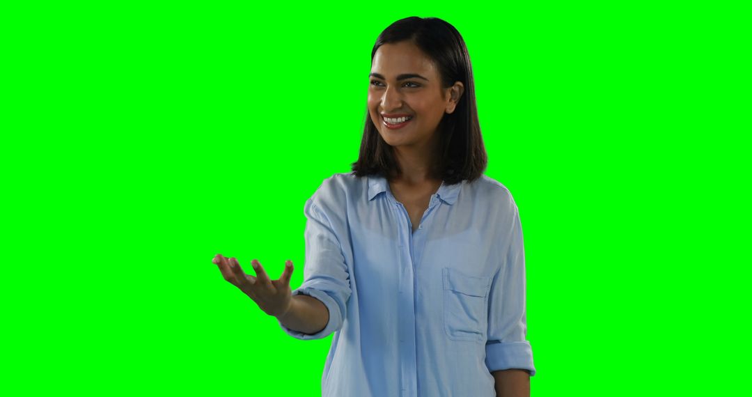 Smiling Woman Reaching Hand Out on Green Screen Background - Free Images, Stock Photos and Pictures on Pikwizard.com