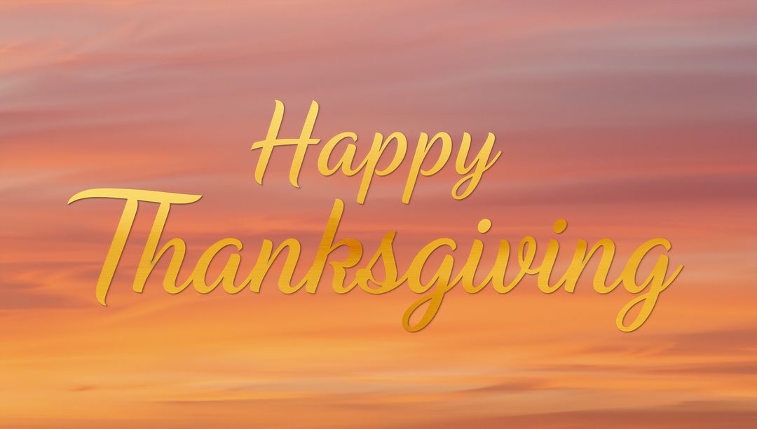 Golden Cursive Happy Thanksgiving Script Over Warm Sunset Background
