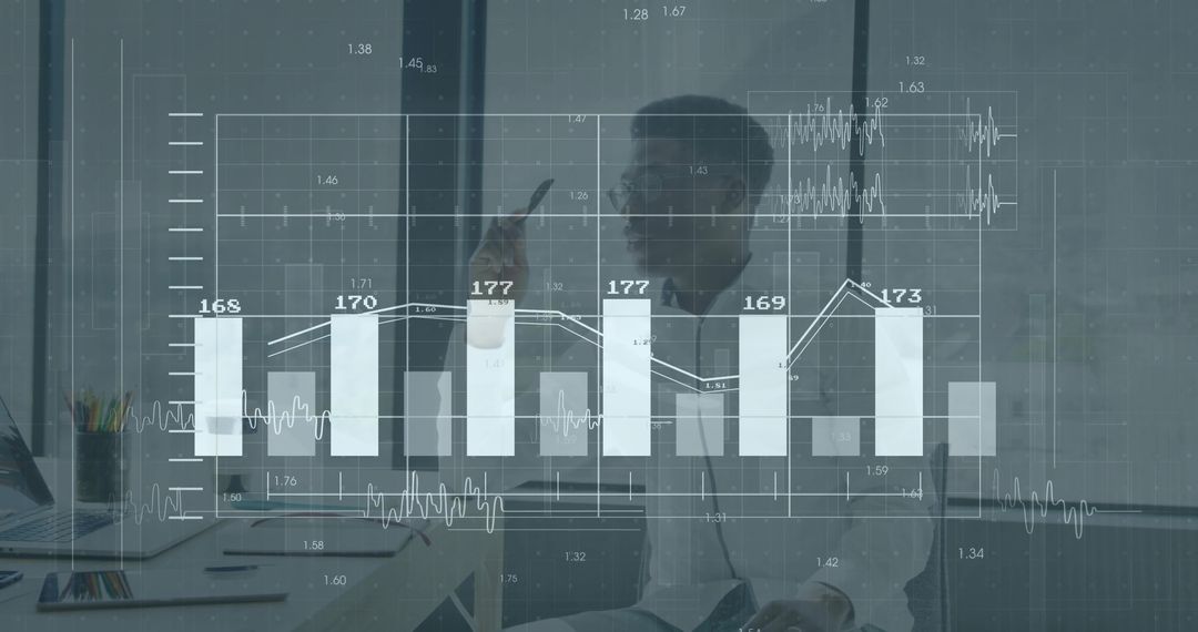 Businessman Analyzing Financial Data with Interactive Charts Overlay in Modern Office