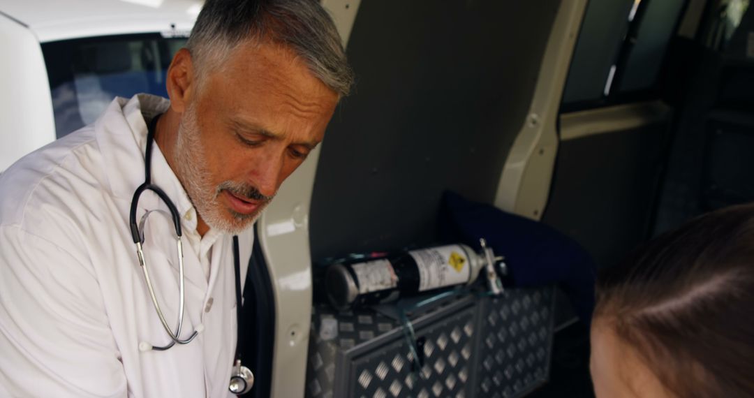 Doctor Treating Patient in Ambulance - Free Images, Stock Photos and Pictures on Pikwizard.com