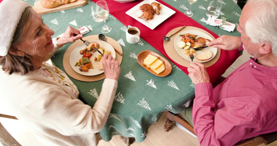 Senior Couple Enjoying Festive Christmas Meal Together at Home