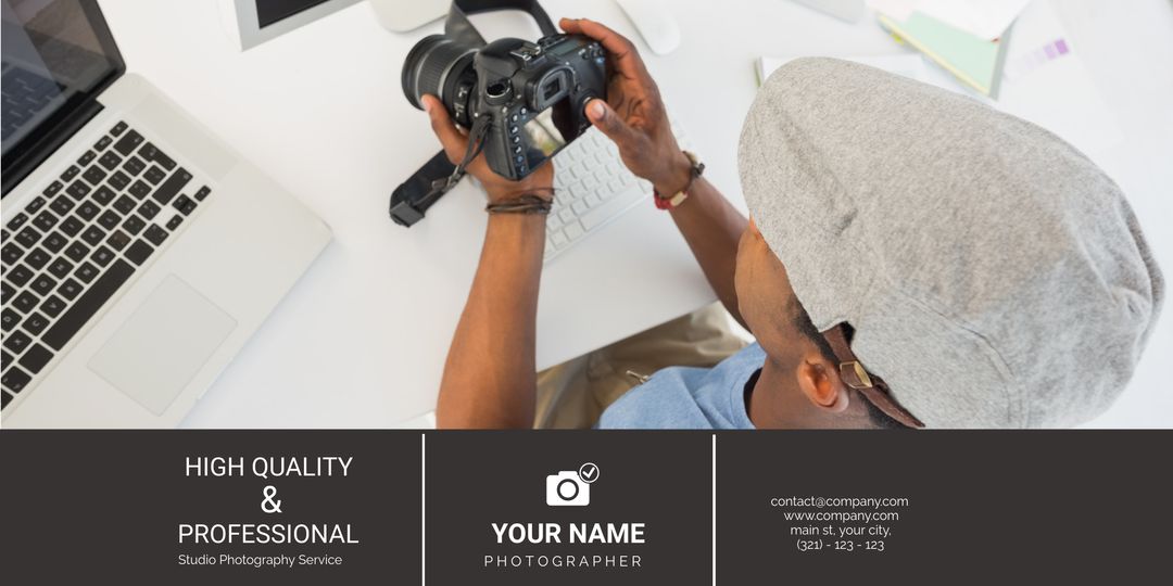 Professional Photographer Examining Camera in Studio Office