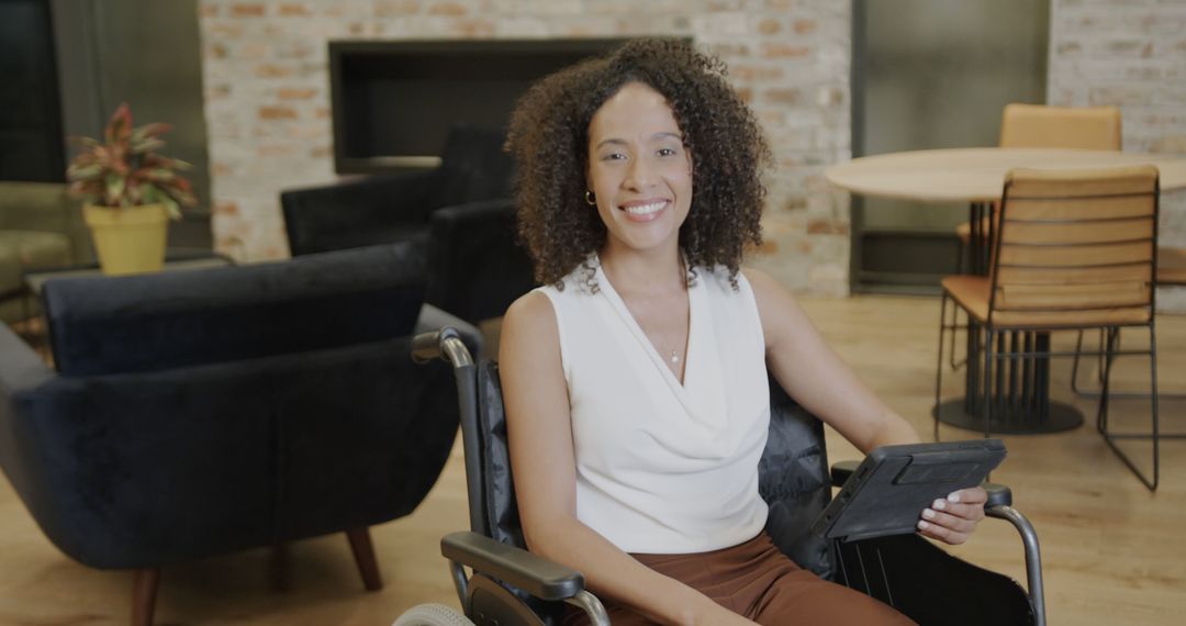 Confident African American Woman in Wheelchair Using Tablet in Cozy Modern Office - Free Images, Stock Photos and Pictures on Pikwizard.com